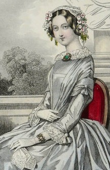 1848, a matching cameo brooch pinned at the collar and bracelet is all the jewelry a lady needs. 