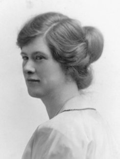 1920 very long straight hair gathered into a large bun with side draped pieces