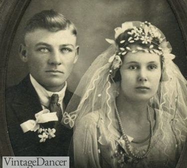 1920 wedding headdress of leaf wreath style with groom bouttounier