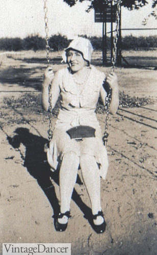 Late 20s teen with cloche hat and summer dress