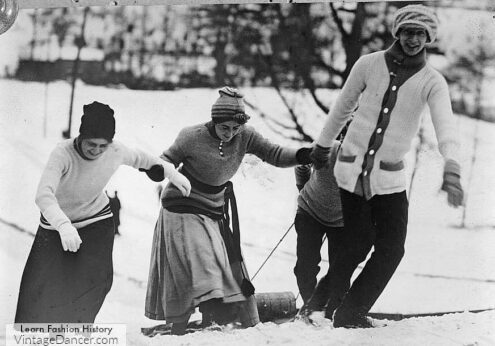 1920s sledding in sweaters and winter snowplay outfits