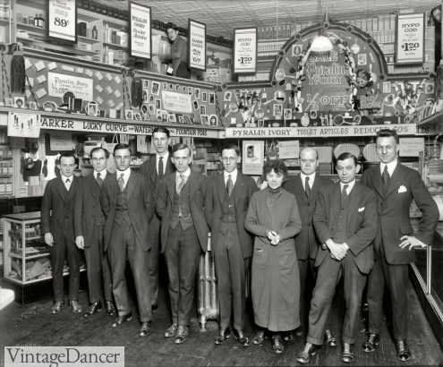 1921 men in suits working at a drug store
