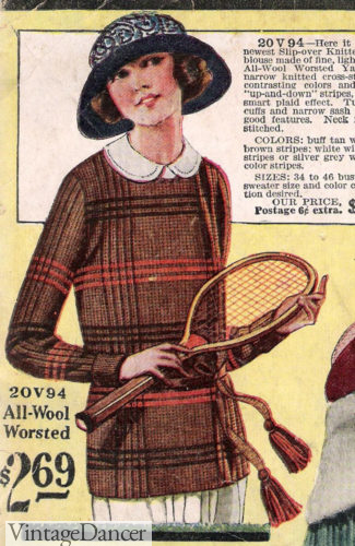 1922 a lovely knit plaid sweater with tie belt. Her floppy hat was also common in the early 20s.