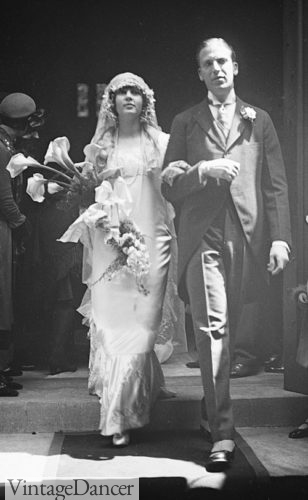 1920s long wedding dress 1924 bridal gown with calla lilies flowers and groom in morning suit