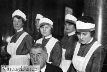 Waitresses at the Carlton Hotel, 1925, still wearing traditional aprons and caps from the 1910s