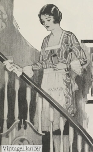 1928 maid or housewife wearing a white half apron