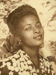 Early 40s, thin shaped eyebrows POC black woman
