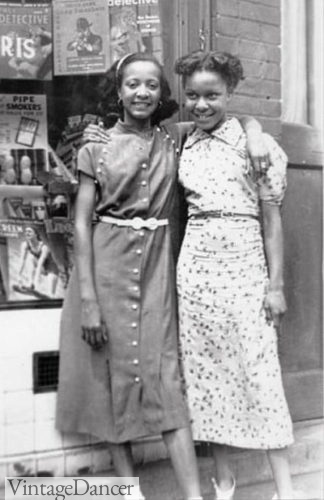 Two African American black teens wearing simple 1930s dresses 1930s fashion for teens teenagers teenage girls
