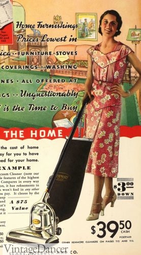 1933 housewife vacuuming in a nice day dress