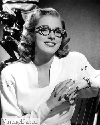 1940s- Actress Eleanor Parker wearing rhinestone studded eyeglasses