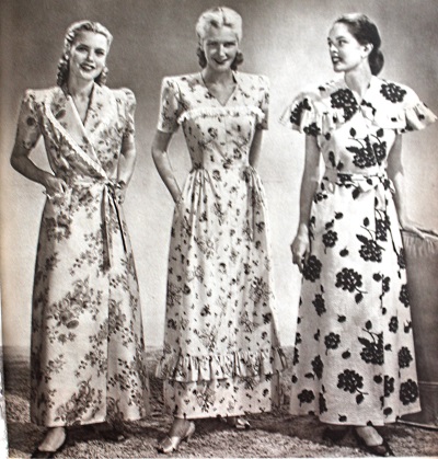 1940s floral robes or house jackets for summer feature the side wrap or sash belt style with puffed sleeves and ruffled trim. Early 1940s.