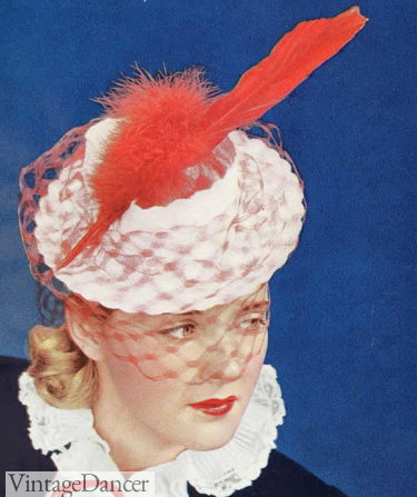 1941 straw hat with red feather and veil