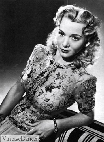 1940s evening top with skirt, beaded sequin decorated blouse and victory roll hairstyles