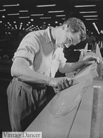 1942 an aircraft plant work wears a striped workshirt