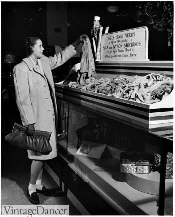 1942 woman donating her silk stockings and wearing socks instead.