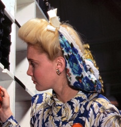 1940s hair accessory: A hair snood from the early 1940s made of a silk or rayon scarf tied with a bow. 