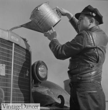 1943. truck driver wears leather jacket and work cap