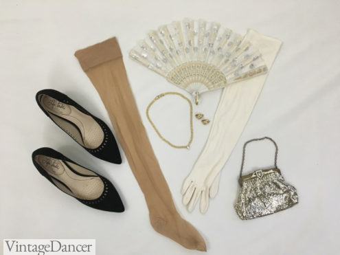 1950s evening formal dress accessories: Kitten heels, nude stockings, gold necklace and earrings, white gloves, white, silver and gold lace fan and silver mesh clasp handbag. More ideas at VintageDancer