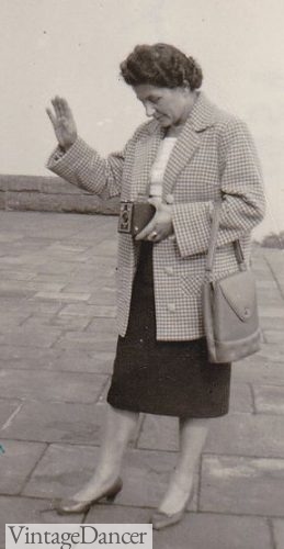 1950s woman in pencil skirt and coat