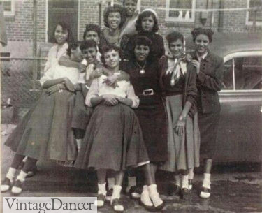1950s teenagers wearing blouses, felt skirts, saddle shoes and bobby socks