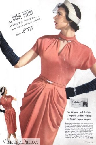 1951, rhinestones accent this dress at the belt and collar