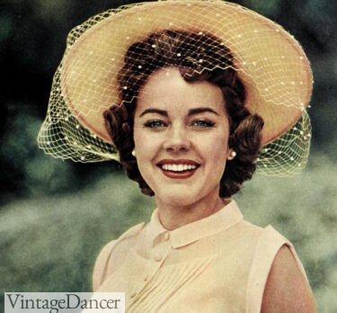 1950s Terry Moore models' a yellow felt sunhat with veil 1954
