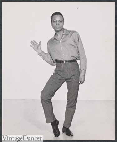 1956 Studio portrait of Hugh Bryant in the stage production Cranks black men blue jeans denim pants and shirt dancer