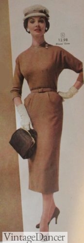 1958 woman inbrown sheath dress and matching purse handbag