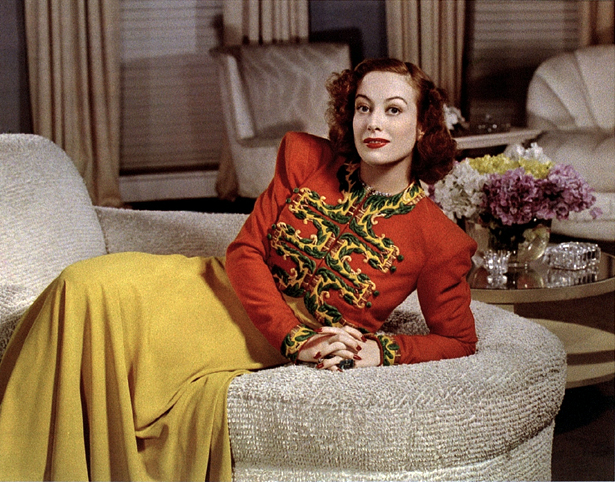 Joan Crawford at her home. lounging 1940s dress coat cape