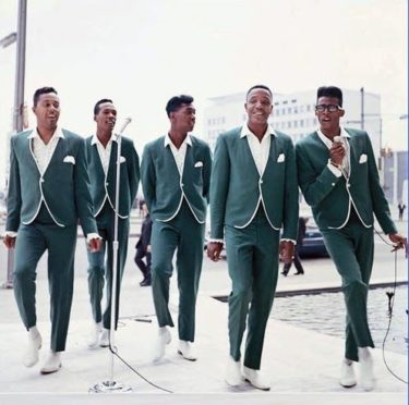 1960s Motown musicians Temptations, green collarless suits with white piping and white boots