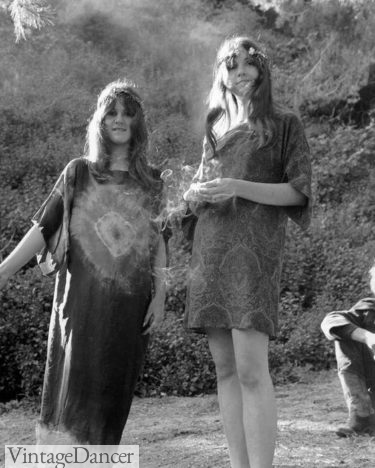 1960s hippie fashion teen girls - two hippie women in headbands wearing handmade tie dye dresses.