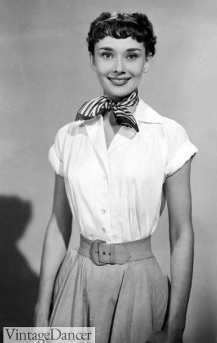 Audrey Hepburn in Roman Holiday wears a button down blouse, neck scarf, white belt and matching skirt at VintageDancer