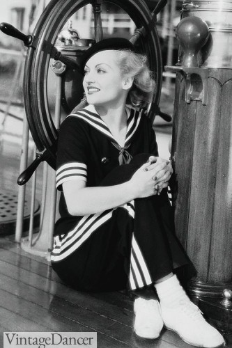 Carole Lombard, 1934, in a matching navy blue sailor shirt and striped pant.
