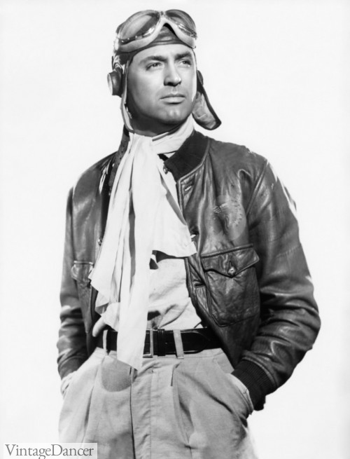 Carry Grant in military pilot attire with white silk scraf