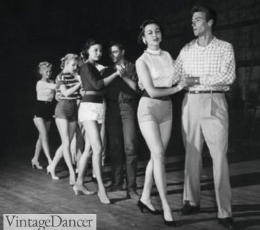 1950s Clint Eastwood practices with women in shorts and knit tops