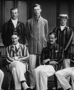 1920s Cricket team wears striped blazers, white trousers, boater hats