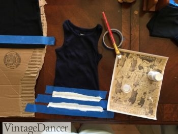 DIY 1920s swimsuit-Painting stripes on a ribbed tank top using masking tape to make even lines.