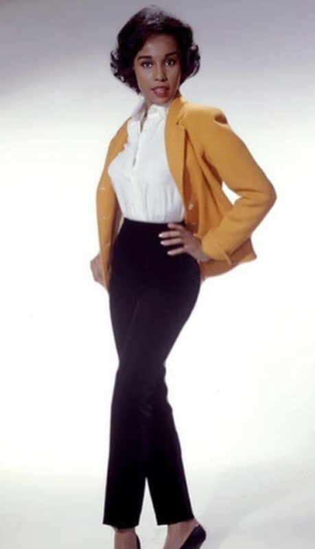 1950s womens fashion pants Diahann Carroll wears cigarette pants, blouse and cardigan