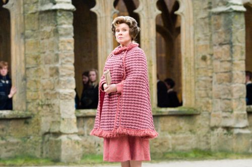Dolores Umbridge from the Harry Potter series. Her costumes favoured an early 1960s silhouette, in her signature shade of pink.