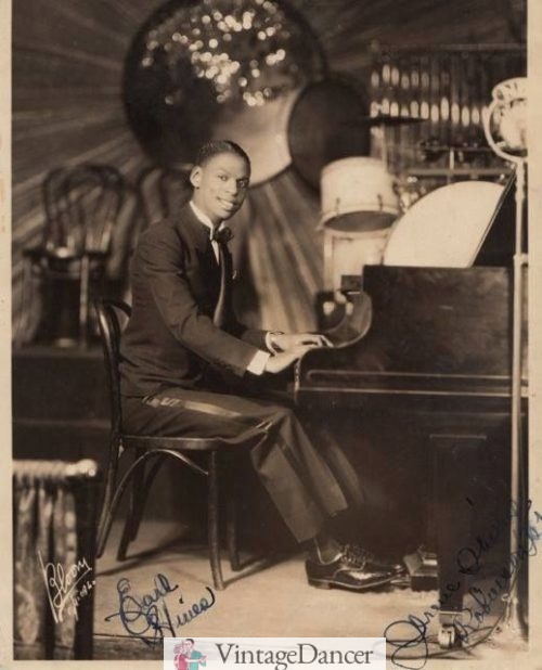 1929, Earl Hines, wears tuxedo pant with silk stripe