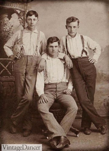 Young men wearing trousers, shirts and suspenders