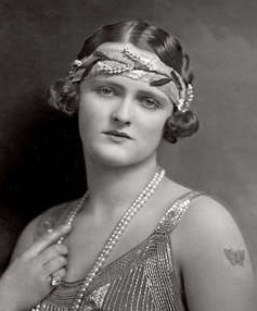 Enid Stamp Taylor, 1924 , wears a large leaf headband 