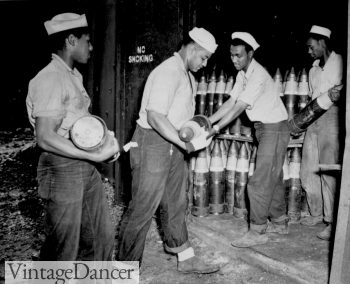 Enlisted Navy men serving on Espiritu Santo in the New Hebrides...placing 6-inch shells in magazines at the Naval Ammunition Depot
