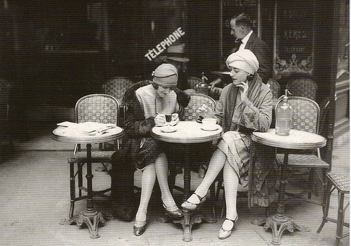 1920s flappers in Paris, France having tea