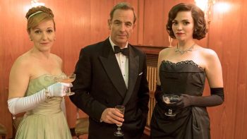 A scene form Grantchester with the ladies in ballgowns