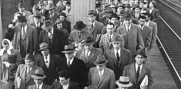 A sea of grey suits and fedora hats in the 1950s movie The Man in the Gray Flannel Suit 