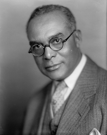 1925 James A. Cobb wears thin frame round glasses