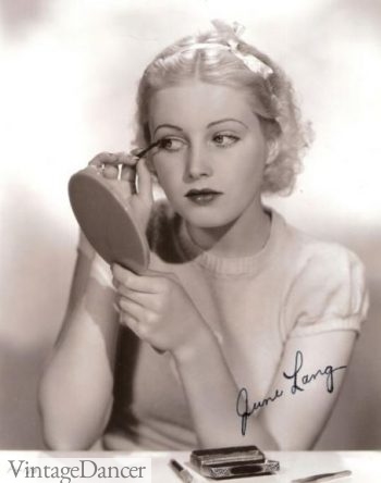 June Lang applying mascara 1930s
