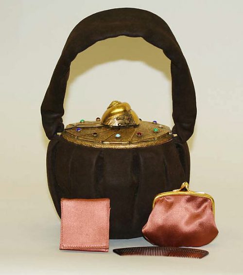 1940s. Delightful purse from the Metropolitan Museum. Here we can see the vanity case influence in evening bags of the period.