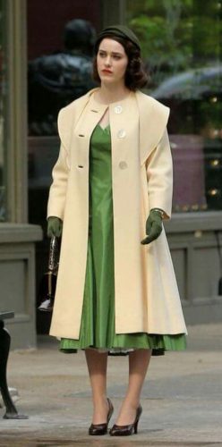 Mrs. Maizel in green swing dress, cream overcoat, gloves, hat and purse